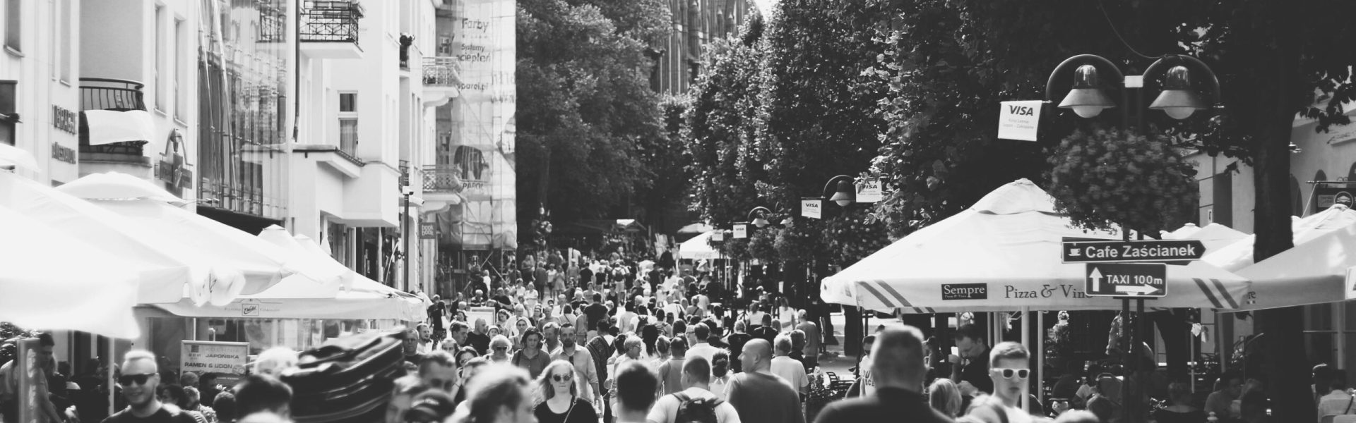 pexels-photo-1245055-1245055 A black and white photo capturing a busy street filled with people in Sopot, Poland during the day.